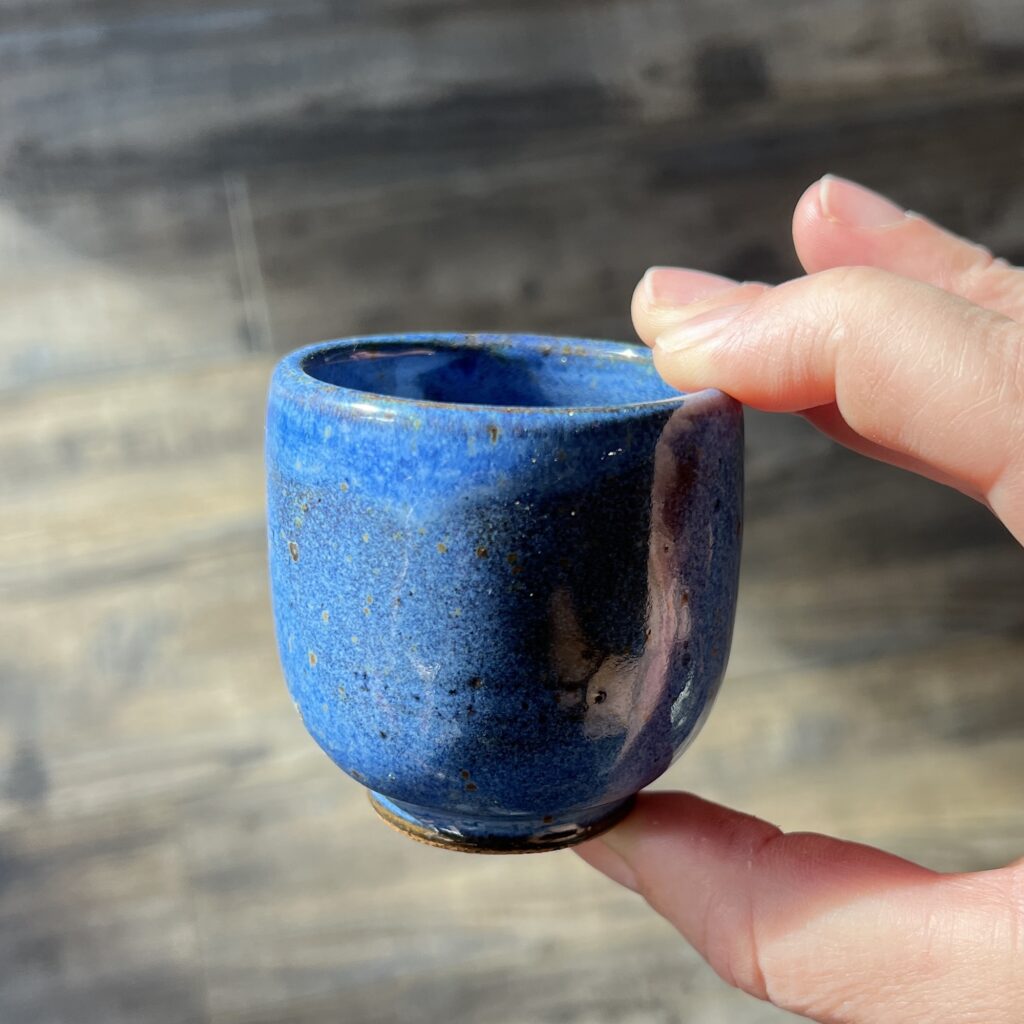 small blue ceramic cup